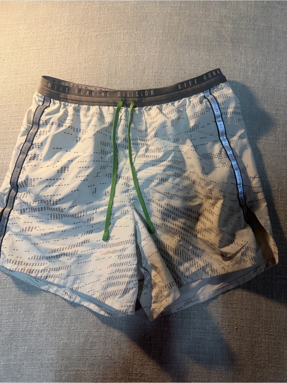 Nike Men's Light Gray Athletic Shorts with Green Drawstring